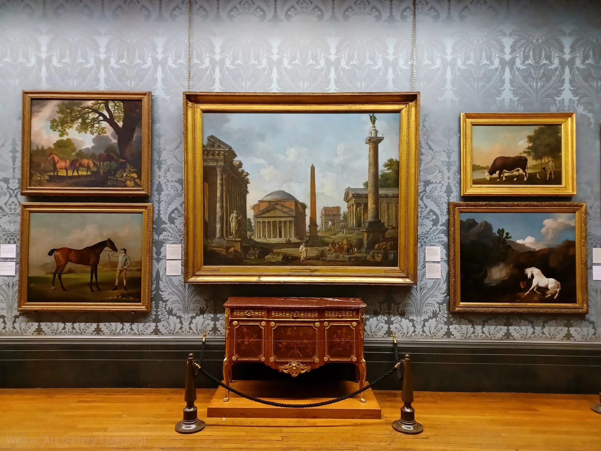 Art gallery scene. Beautiful traditional wallpaper with paintings hanging on the wall near baroque style vintage furniture.