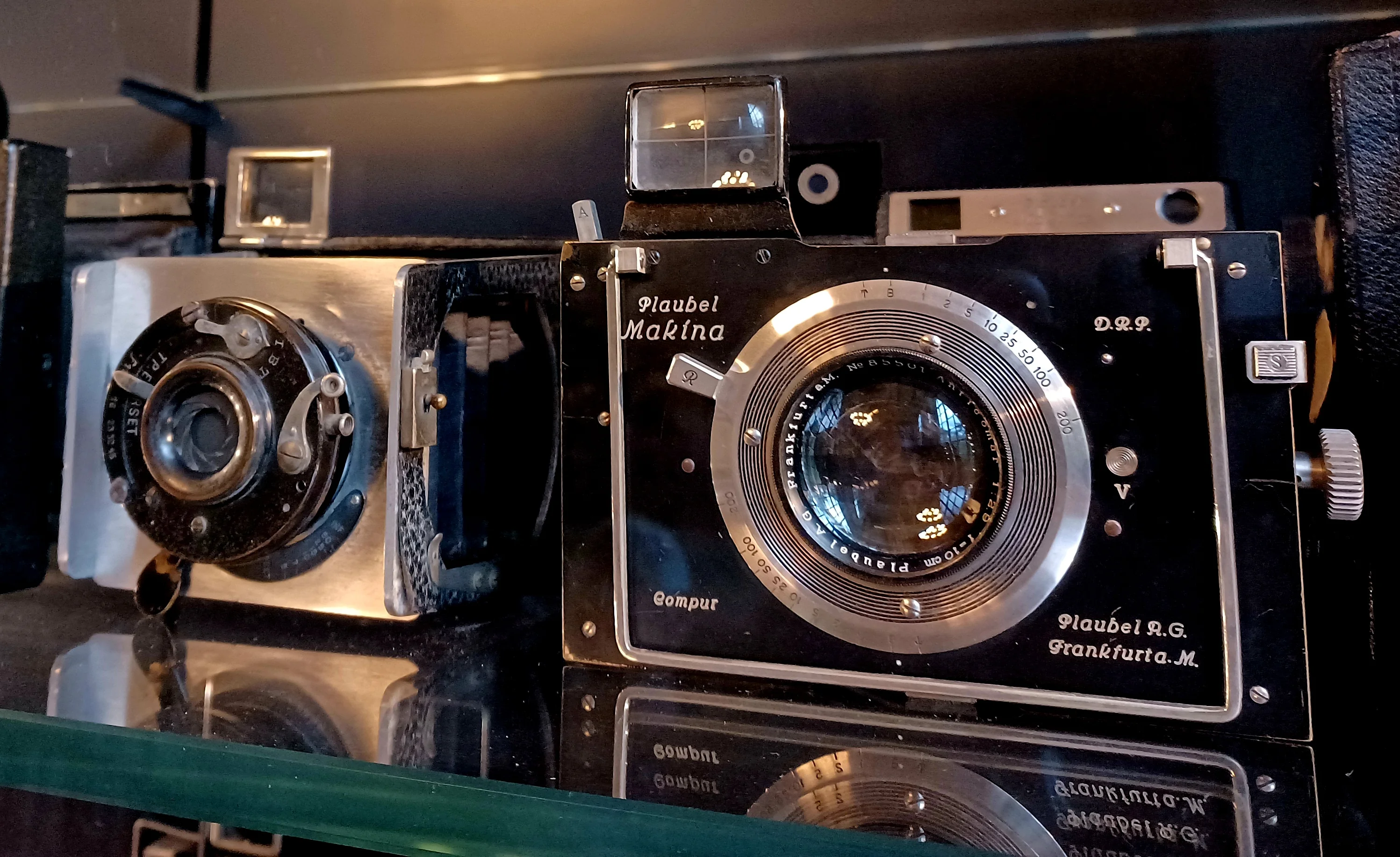 Image 2 also shows some of the earliest cameras ever mass produced. They are in really good condition and their aesthetics are beautiful. These can be viewed in the Victoria & Albert Museum in London.