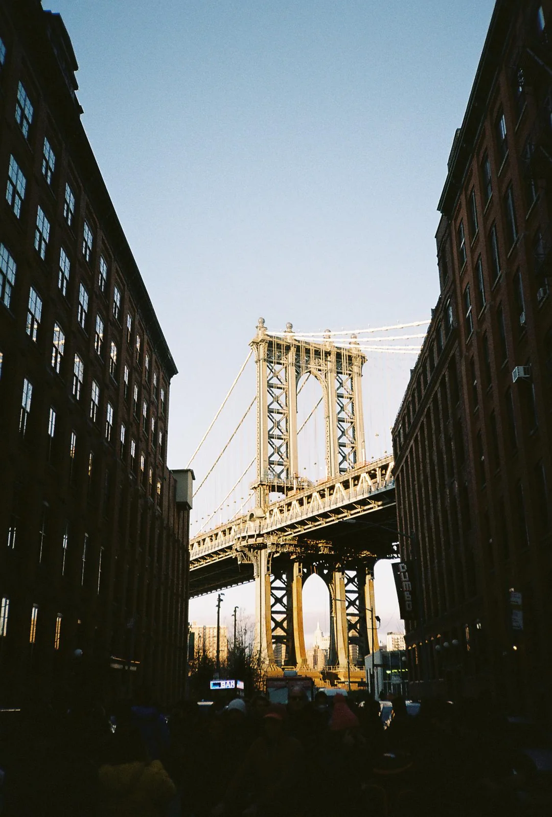 Photo of Brooklyn Bridge taken from the lower streets below