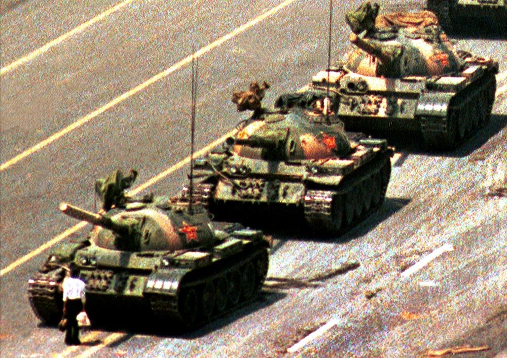 The Tank Man photo shows an unidentified man standing defiantly in front of a line of tanks in Beijing's Tiananmen Square on June 5, 1989. This powerful image symbolizes individual resistance against oppression.
